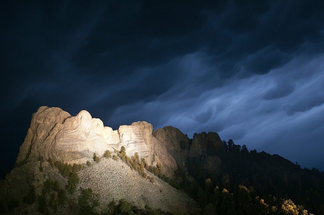 Storm clouds over Mount Rushmore National Memorial, at night, South Dakota, USA