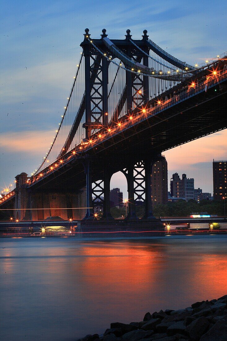 USA, New York, Manhattan Bridge at dusk, view from Brooklyn, East River and Manhattan Skyline
