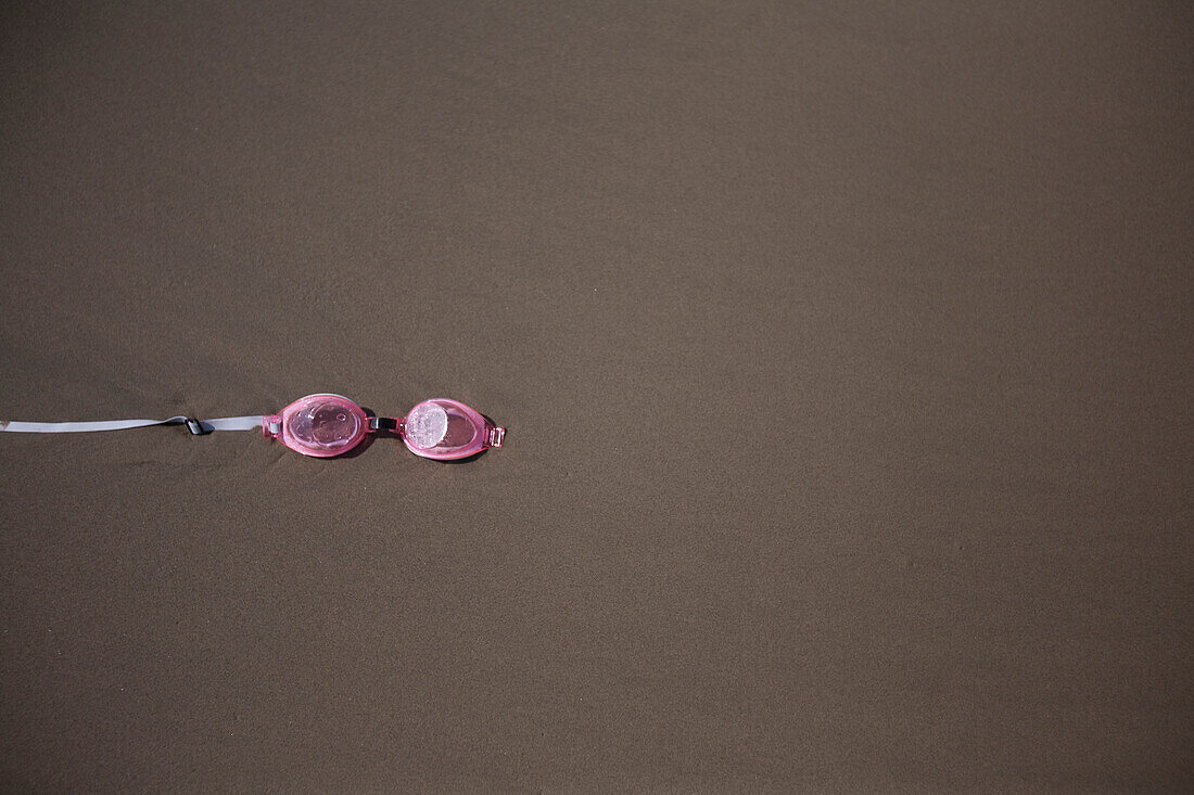 Swim Goggles on Sand