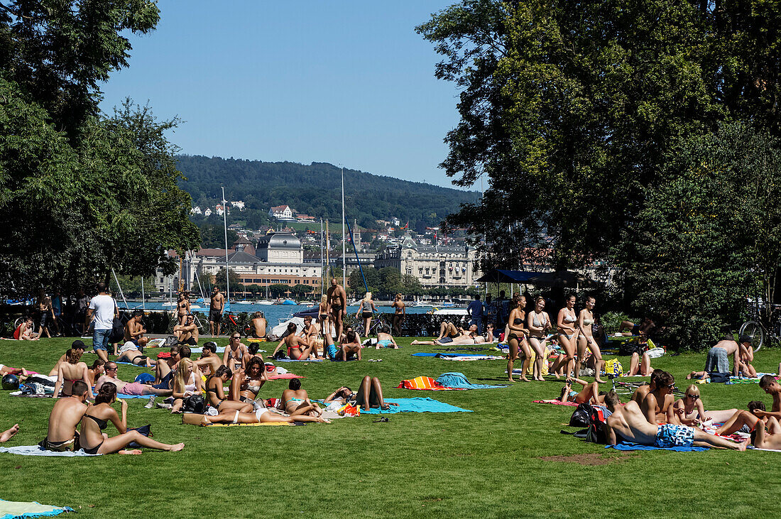 People sunbathing near Zuri lake, Switzerland, Zurich