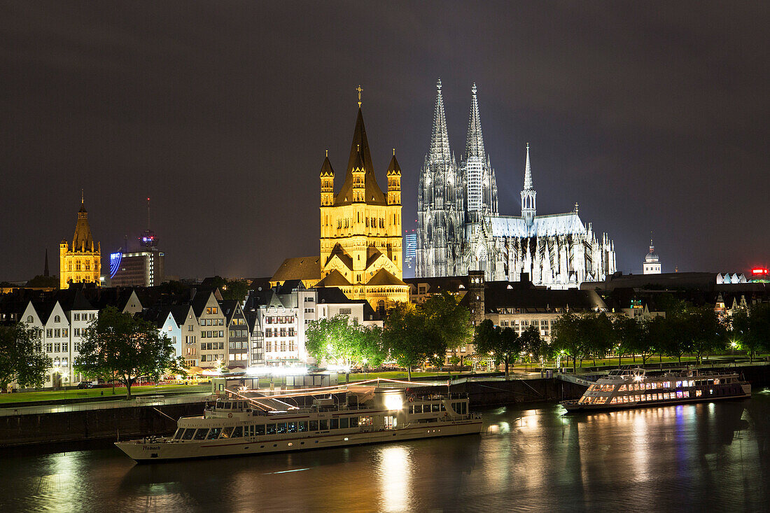 View over river Rhine to old town, Heumarkt with cathedral and Great St. Martin church, Cologne, North Rhine-Westphalia, Germany, Europe