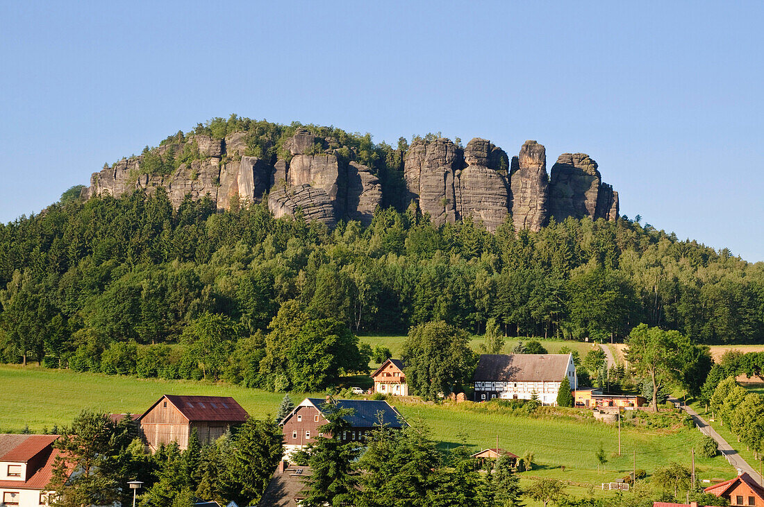 Houses and meadows in front of Pfaffenstein, Elbe Sandstone mountains, Saxon Switzerland, Saxony, Germany, Europe