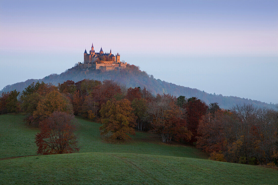 View to Hohenzollern castle in morning mist, near Hechingen, Swabian Alb, Baden-Wuerttemberg, Germany