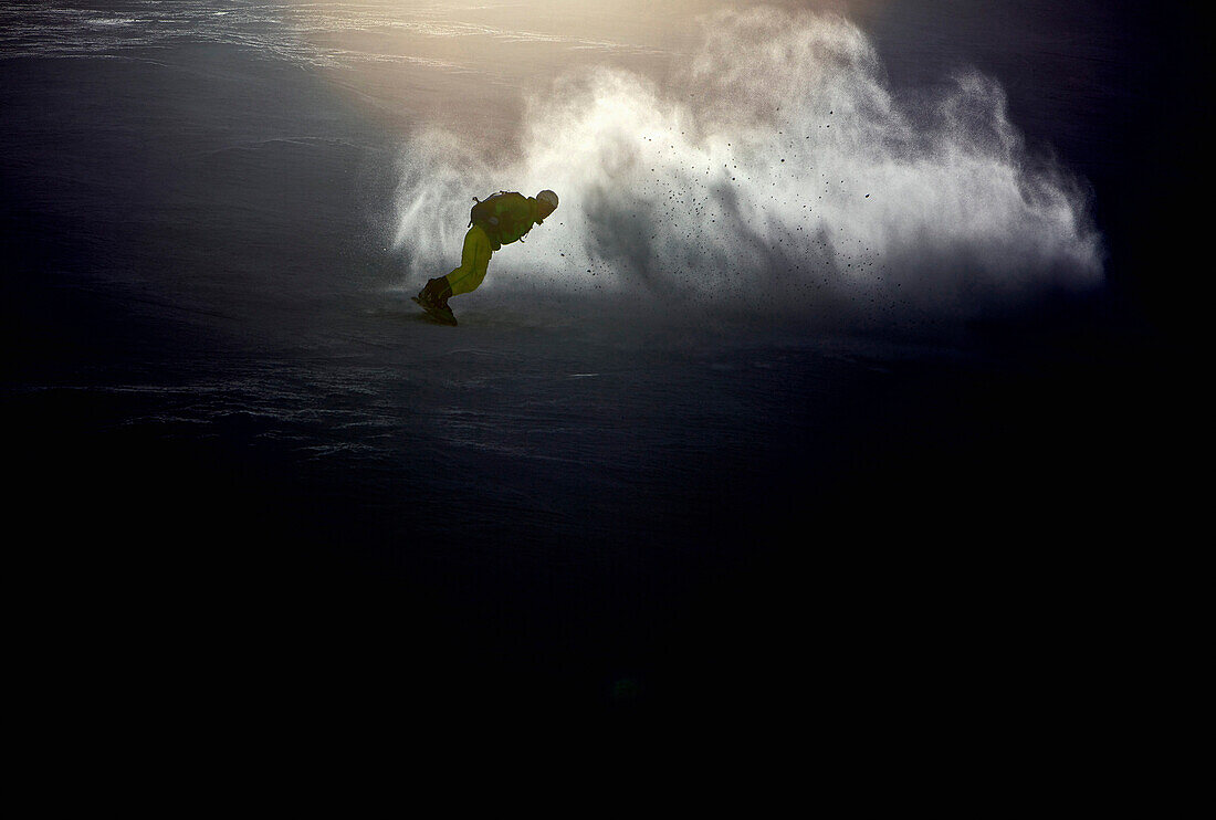 Snowboarder riding downhill, Hahnenkamm, Tyrol, Austria