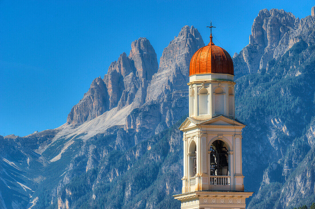 Church tower of Auronzo with Tre Cime di Lavaredo, Auronzo, Sexten Dolomites, Belluno, Italy