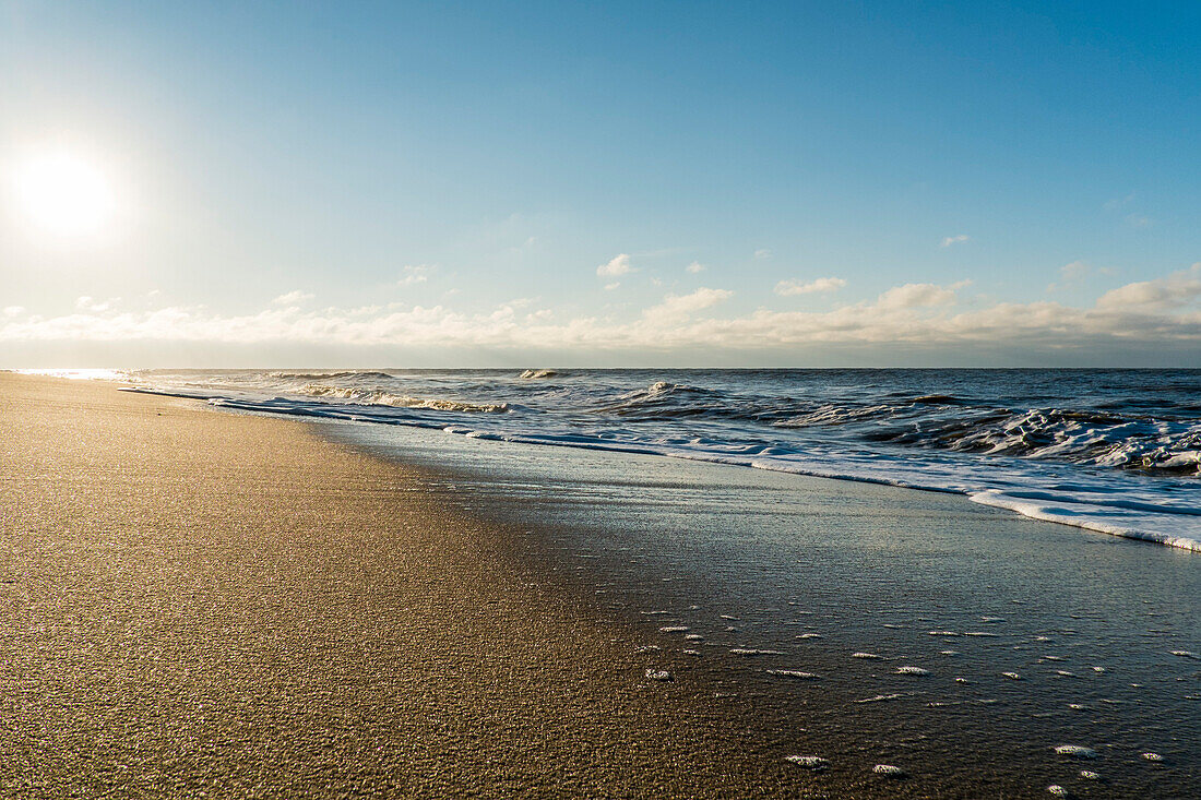 Water spray and waves at the beach of Rantum, island of sylt, north germany, germany