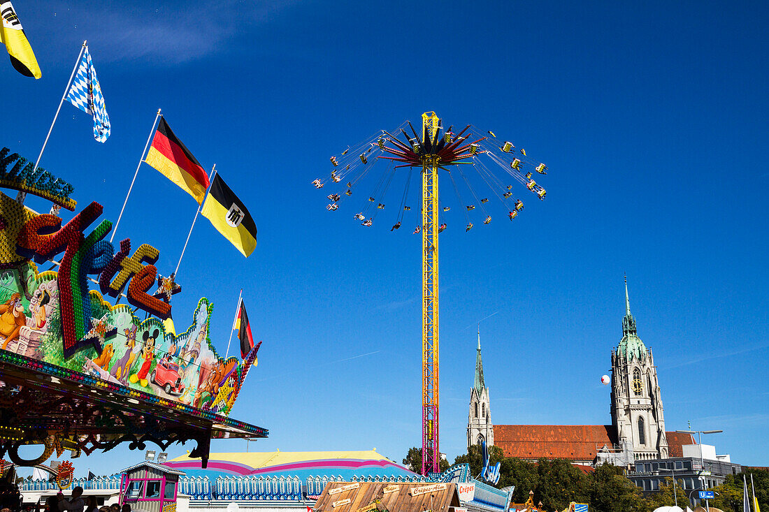 Carousel at the Oktoberfest, St Pauls cathedral, Munich, Upper Bavaria, Bavaria, Germany