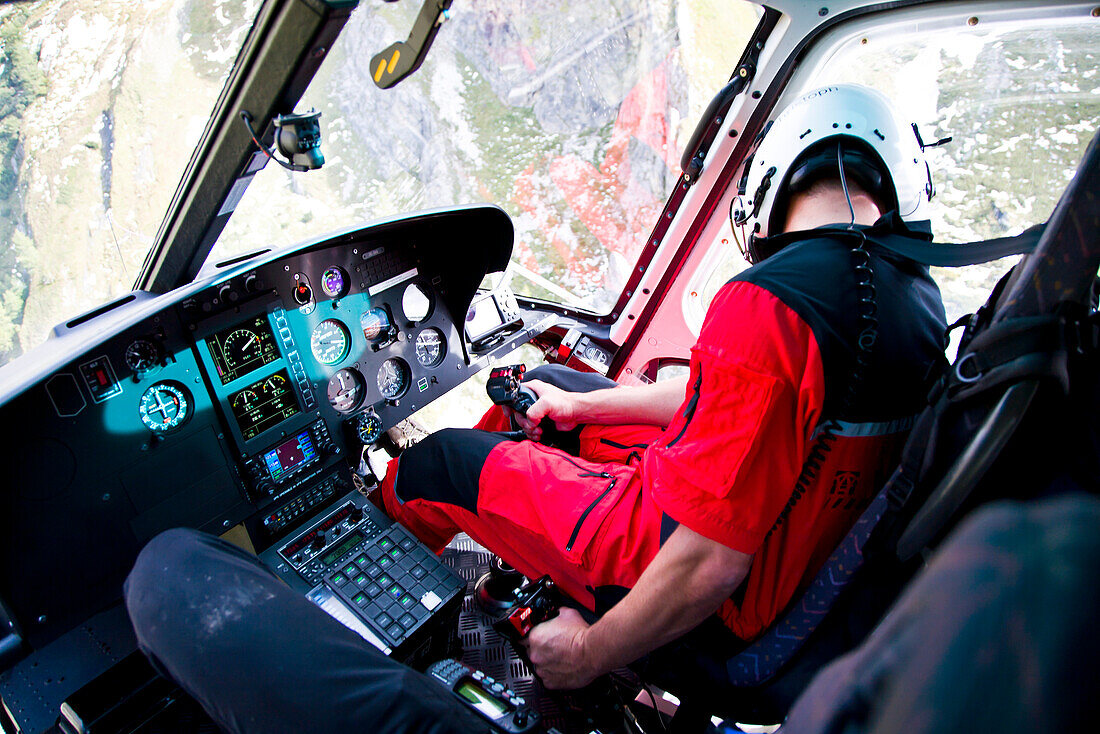 Pilot inside a helicopter looking down, Stuedl hut, Grossglockner, Tirol, Austria