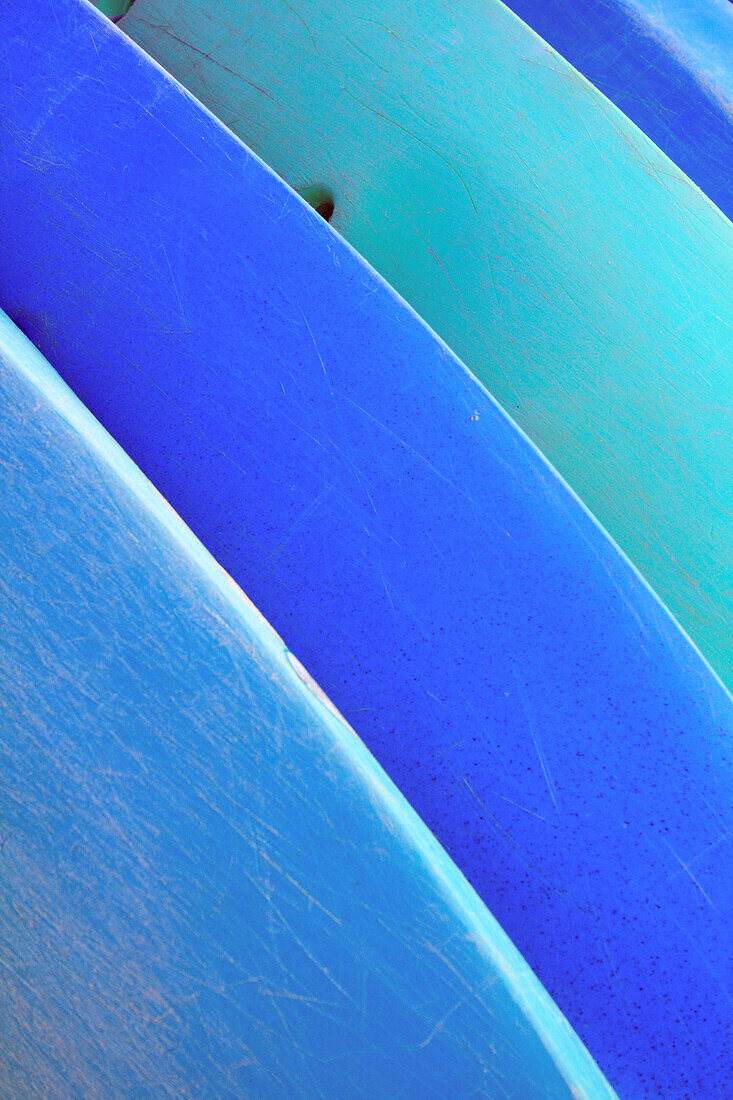 Hawaii, Oahu, Pattern shot of blue Kayaks stacked on each other.