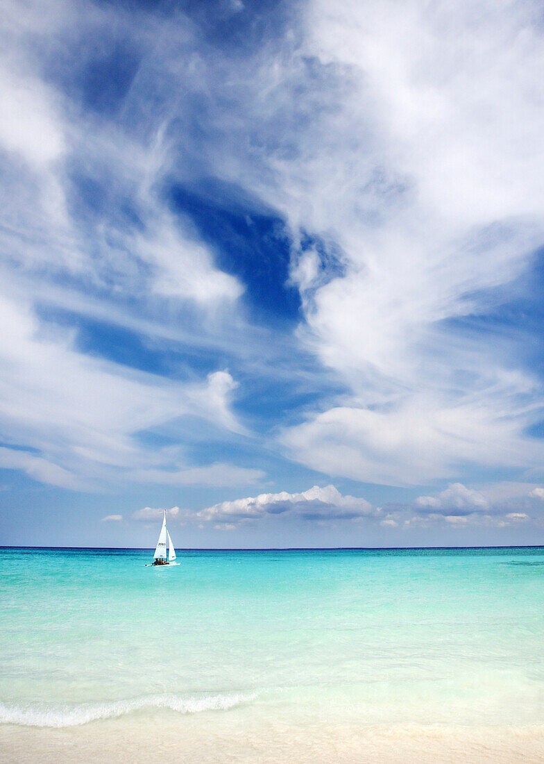 Mexico, Yucatan Peninsula, Sailboat sailing on turquoise water.