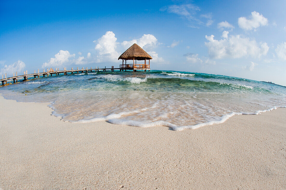 Mexico, Yucatan Peninsula, Tulum, Pier over turquoise ocean.