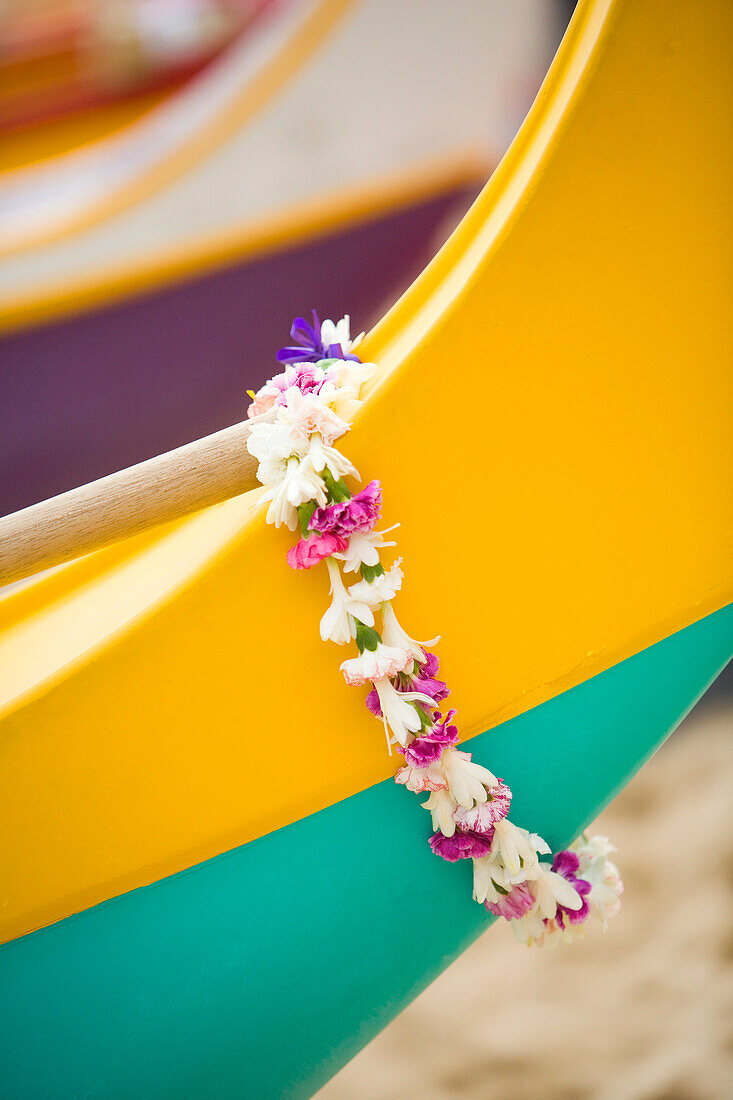 Hawaii, Oahu, lei draped over outrigger canoe.