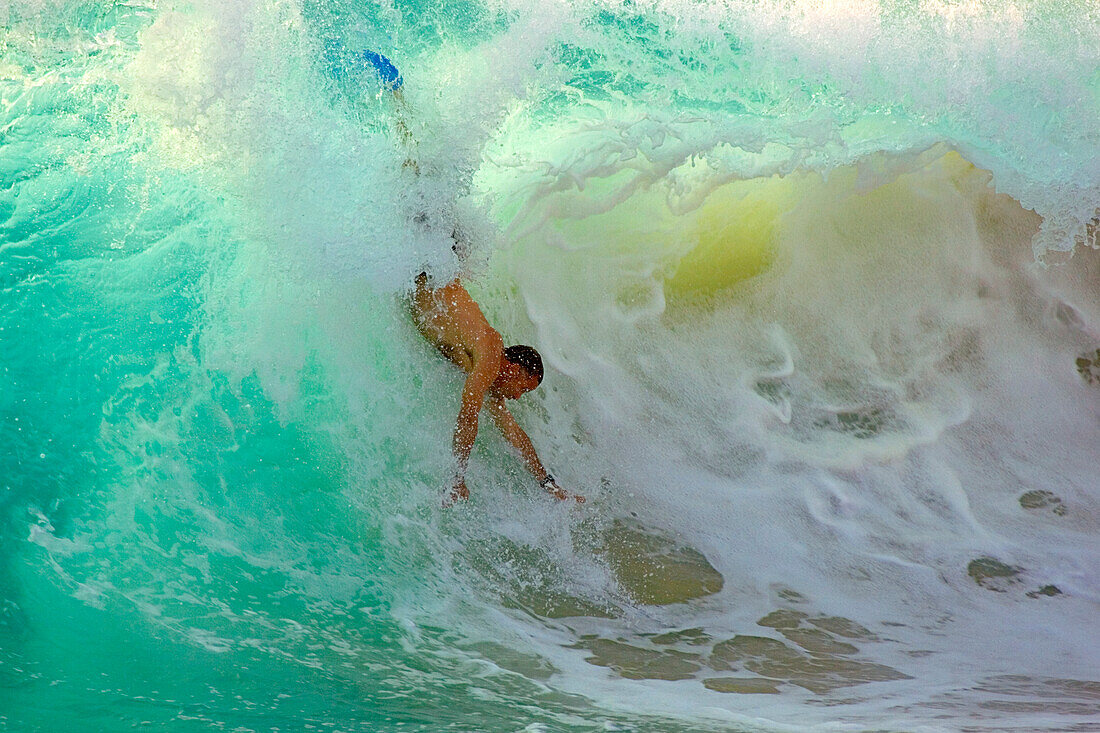 Hawaii, Big Island, Kona, bodysurfer riding a large wave.