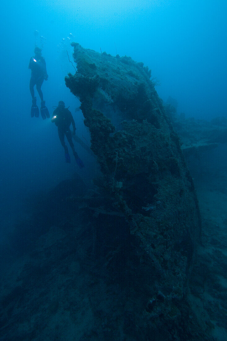Micronesia, Palua, Scuba divers explore a wreck.