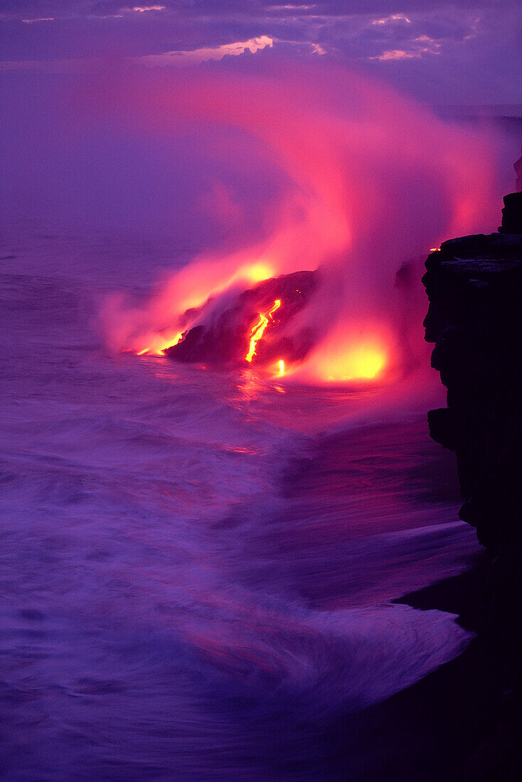 Hawaii, Big Island, Volcano lava meets the sea, steam rising, twilight A28E