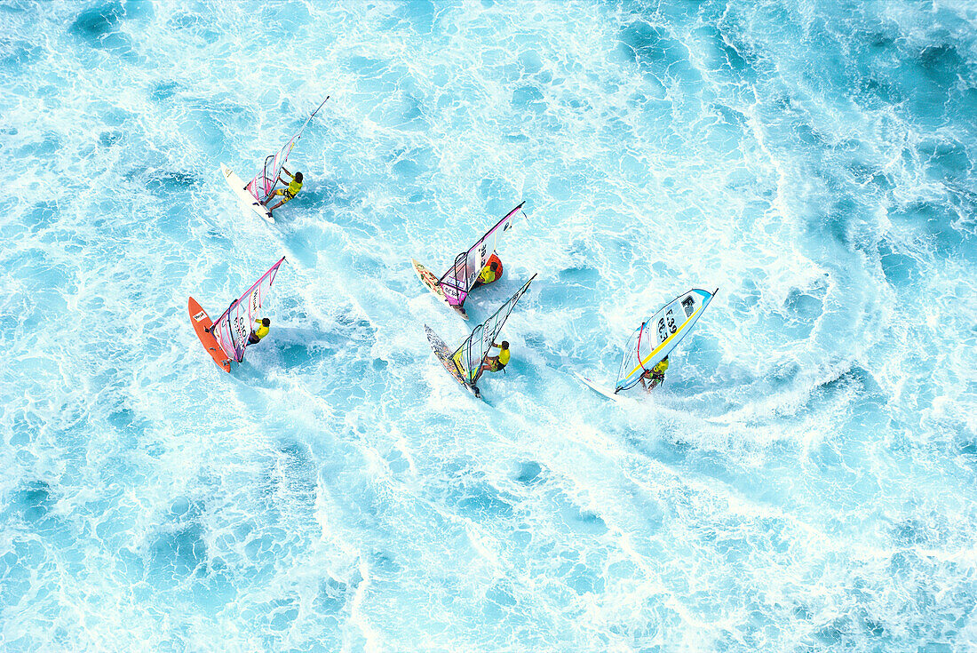 Hawaii, Maui, Ho'okipa, group windsurfing in whitewash ocean, aerial shot A10C