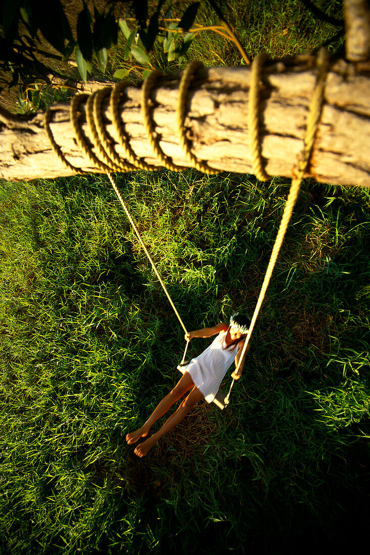 View from the tree, woman in swing with flower haku, green grass B1201