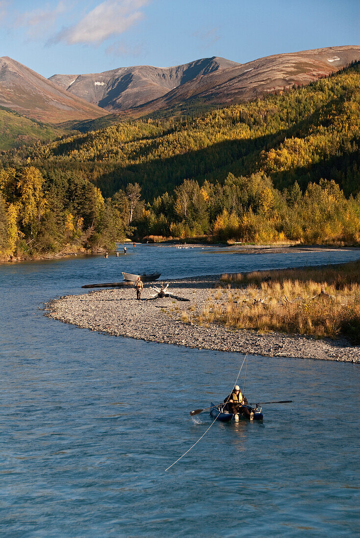 United States, Alaska, Kenai River, fishermen, pontoon boat in foreground.