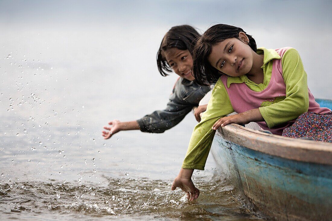 'Orphaned Girl Sitting In Boat; Pokhara, Nepal'