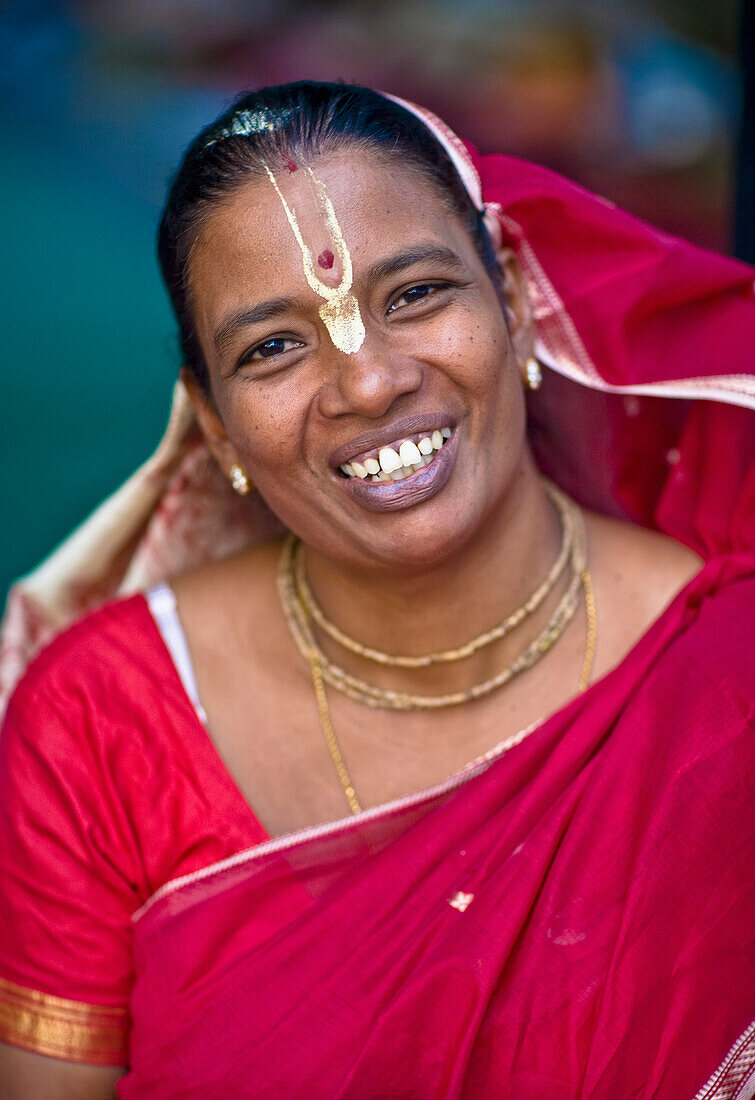 'Portrait Of A Woman Wearing A Red Sari With A Bindi; India'