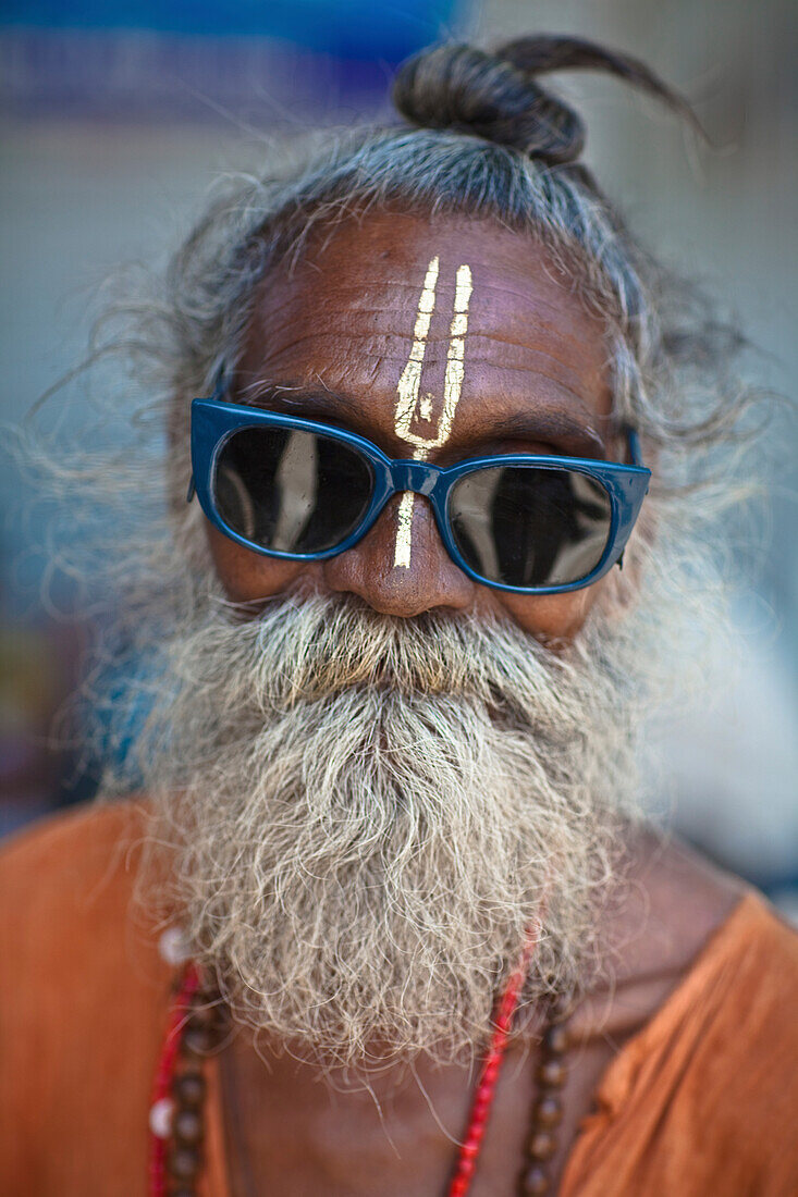 'A Holy Man Wearing Sunglasses With A Third Eye Painted On His Forehead; Haridwar India'