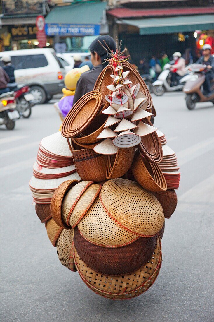 Vietnam,Hanoi,Mobile Conical Hat and Basketware Vendor