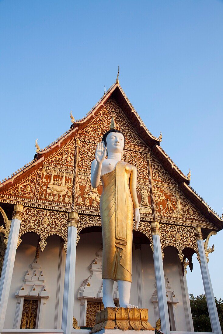 Laos,Vientiane,Pha That Luang,Buddha Statue at Sunrise