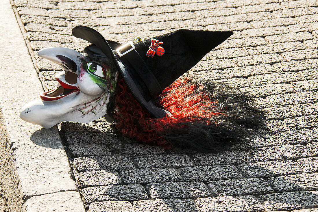 Carnival mask of a witch on the floor, Carnival of Basel, canton of Basel, Switzerland
