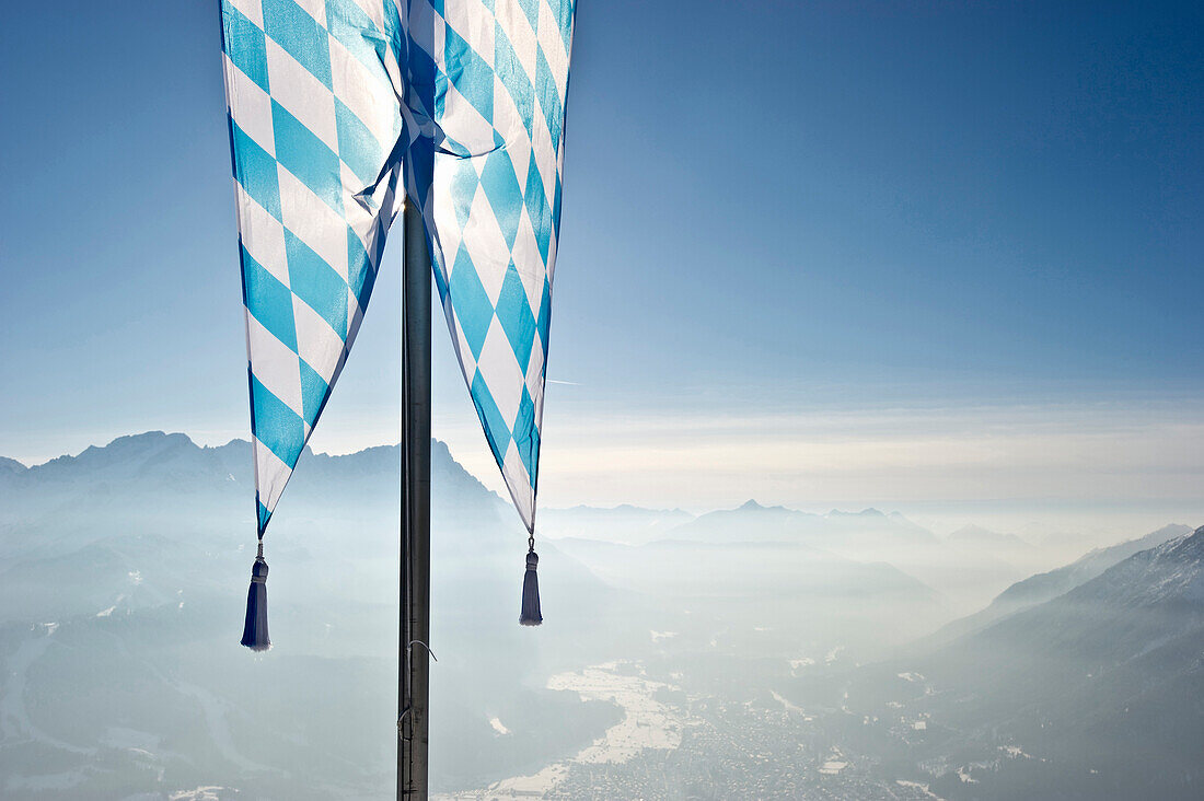 Bavarian flag on the Wank mountain, Zugspitze in the background, Garmisch-Partenkirchen, Bavaria, Germany