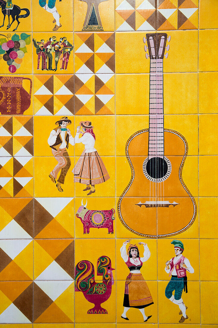 Colorful tiles depicting dancers and musicians on the wall of Adoga Machado Fado restaurant and club, Bairro Alto, Lisbon, Lisboa, Portugal