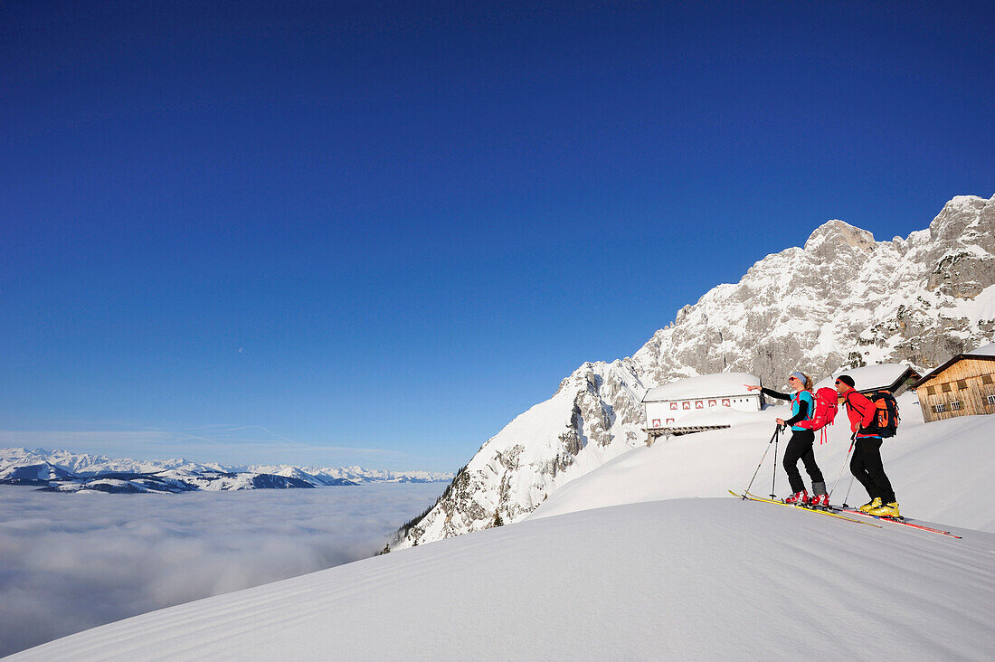 Two backcountry skiers ascending to hut Gurttenhuette, Kaiser-Express, Rote-Rinn-Scharte, Wilder Kaiser, Kaiser mountain range, Tyrol, Austria
