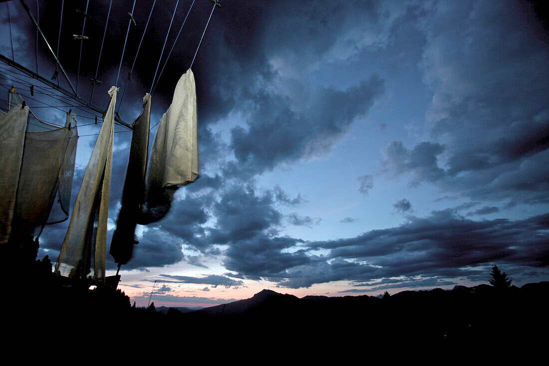 Clothesline in the mountains while a sunset, Oberberg, Bavaria, Germany