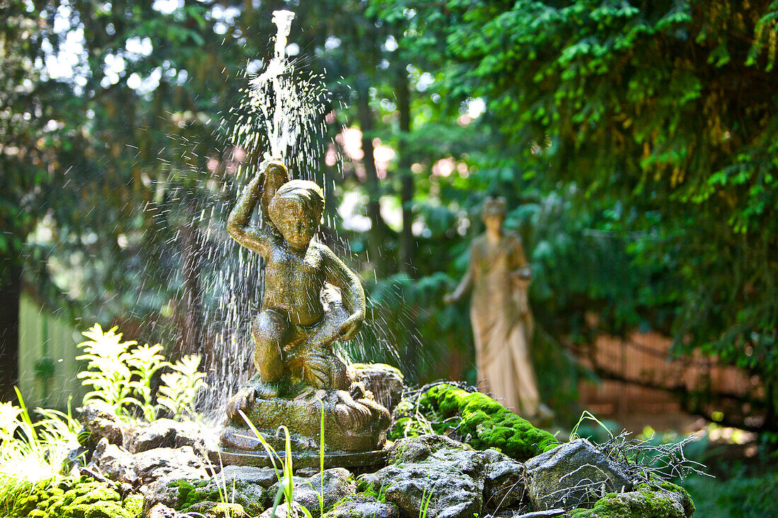 Fountain with a sculpture in the formal garden, Vienna, Austria