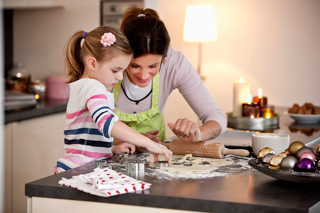 Mother and daughter baking cookies, Styria, Austria