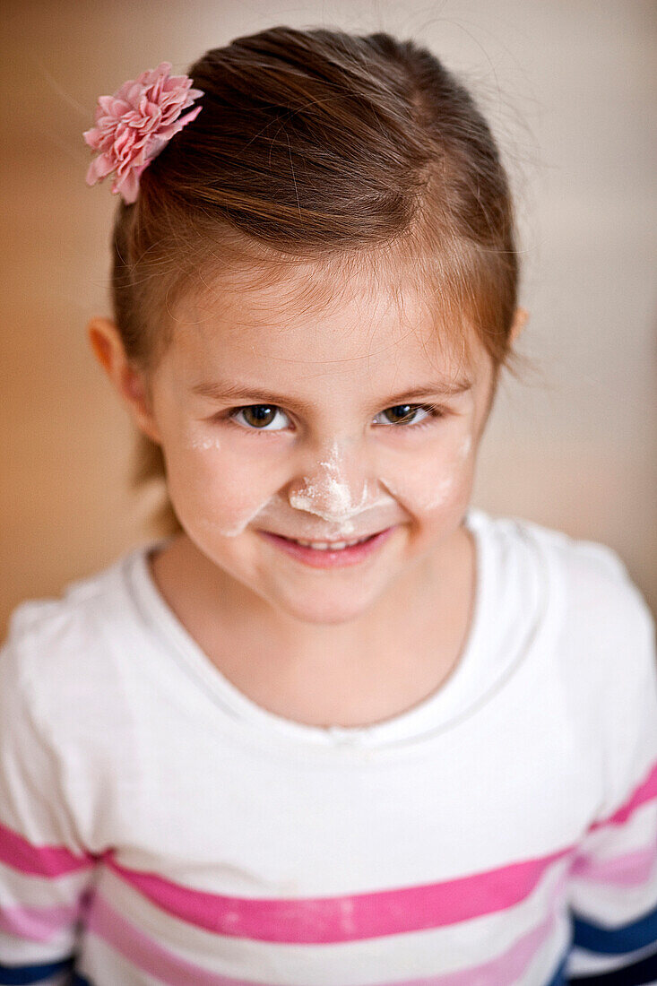 Girl (4 years) with flour on her face