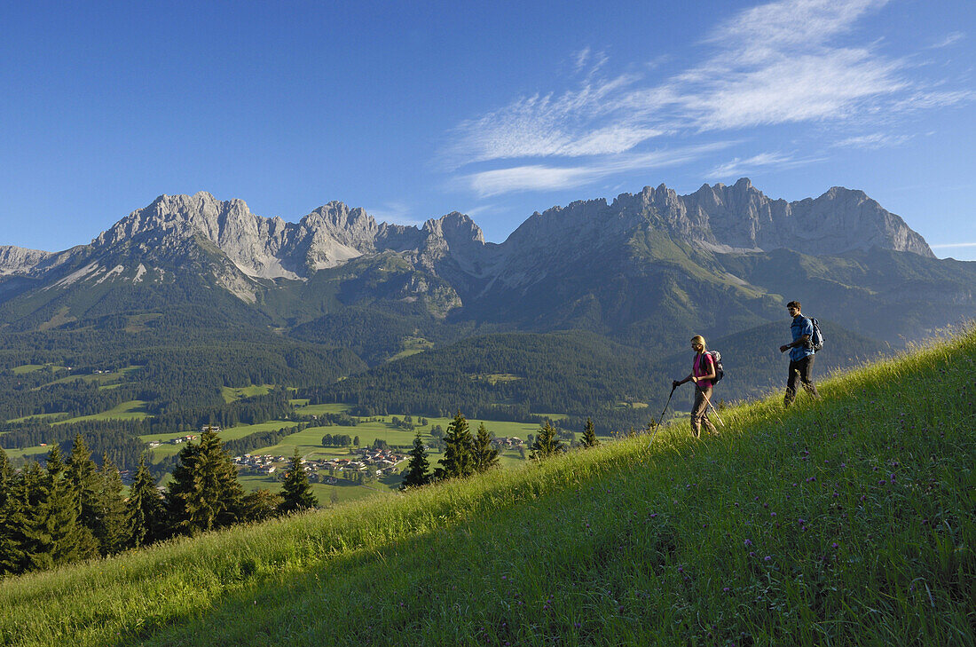 Hikers on Hausberg mountain, Hartkaiser, View towards Wilder Kaiser, Tyrol, Austria