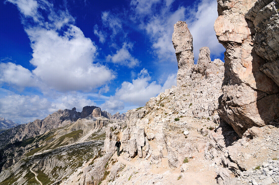 Teenager climbing on the Paternkofel fixed rope route past the Frankfurter Wuerstel rock, via ferrata, Boedenseen, Hochpustertal, Dolomites, South Tyrol, Italy