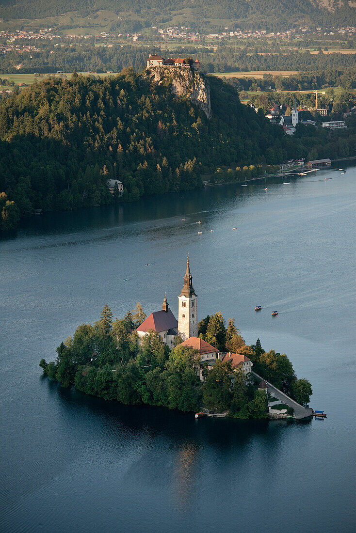 View at St. Mary Church at tiny island of Lake Bled, castle, Osojnica viewpoint, Julian Alps, Gorenjska, Slovenia