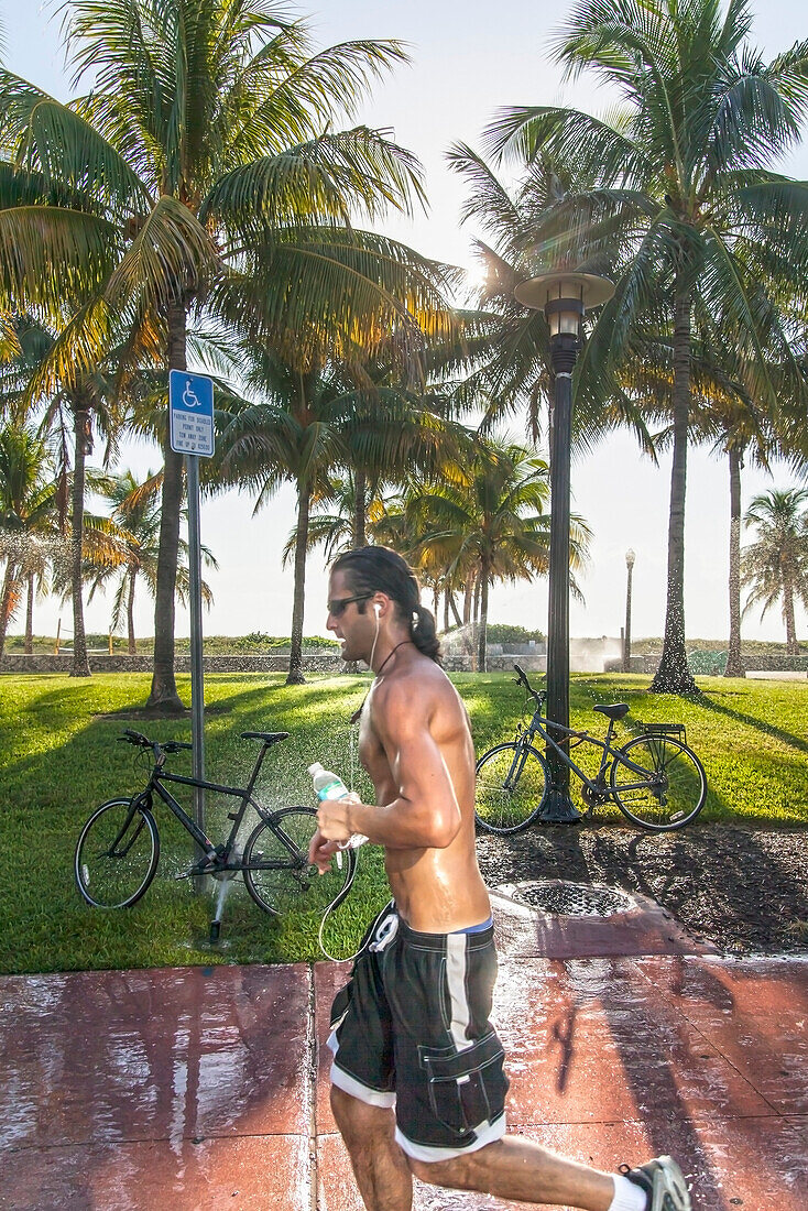 Jogger on Ocean Drive, South Beach, Miami, Florida, USA