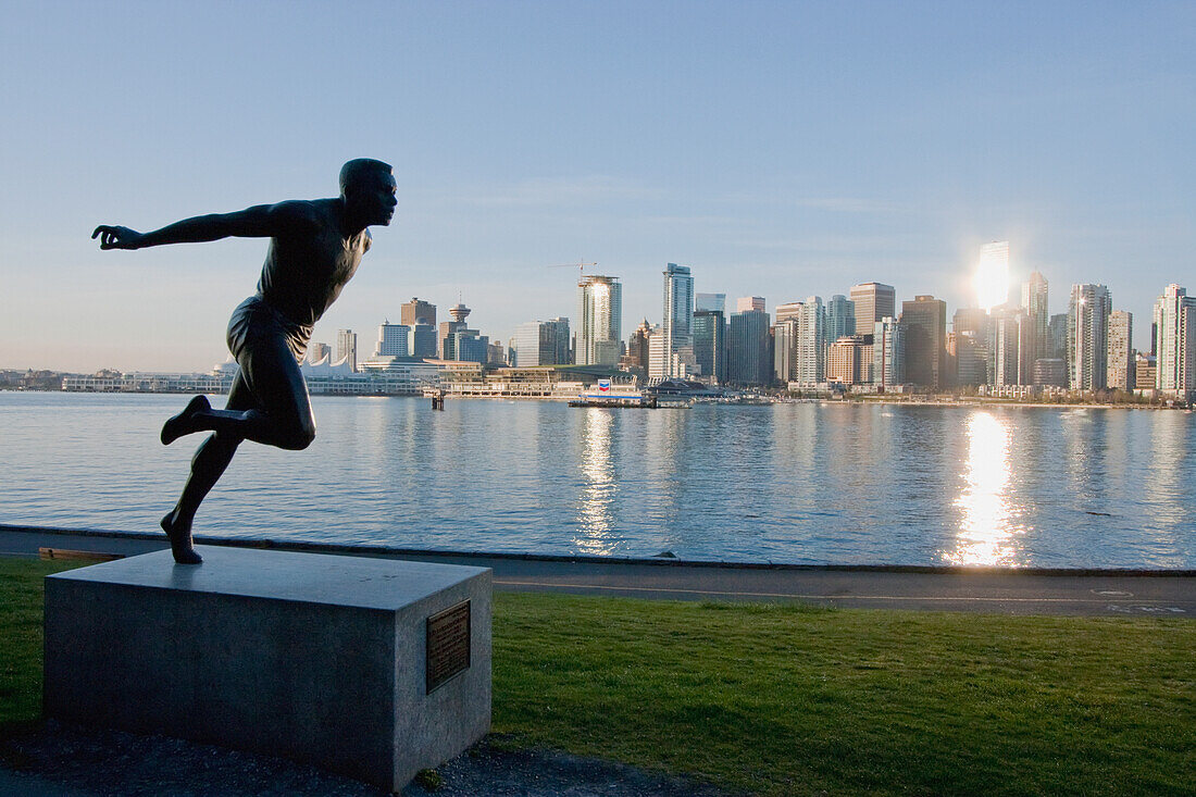 Statue of Olympic runner, Harry Jerome in Stanley Park at sunrise, Vancouver, British Columbia, Canada