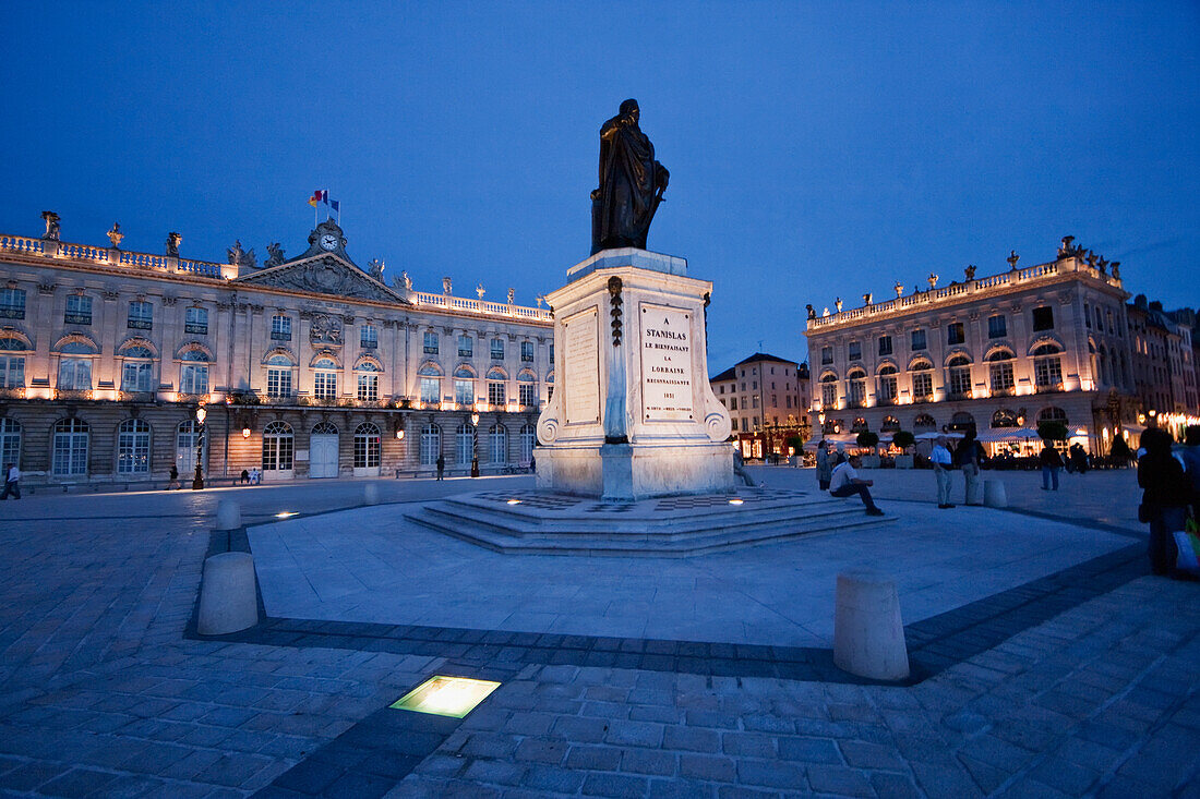 Hotel de Ville (City Hall) and Statue of Stanislas Leszczynski, King of Poland, created by Georges Jacquot in the center of Place Stanislas at night, , Nancy, France
