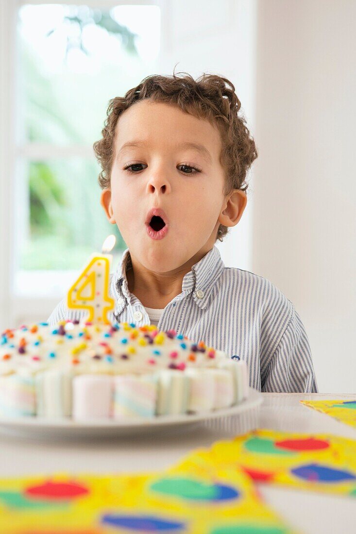 Four year old boy celebrating his birthday