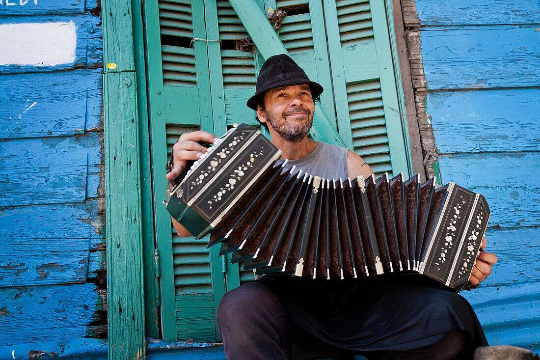 Musician playing the bandeon at Caminito area in La boca  Buenos Aires, Argentina