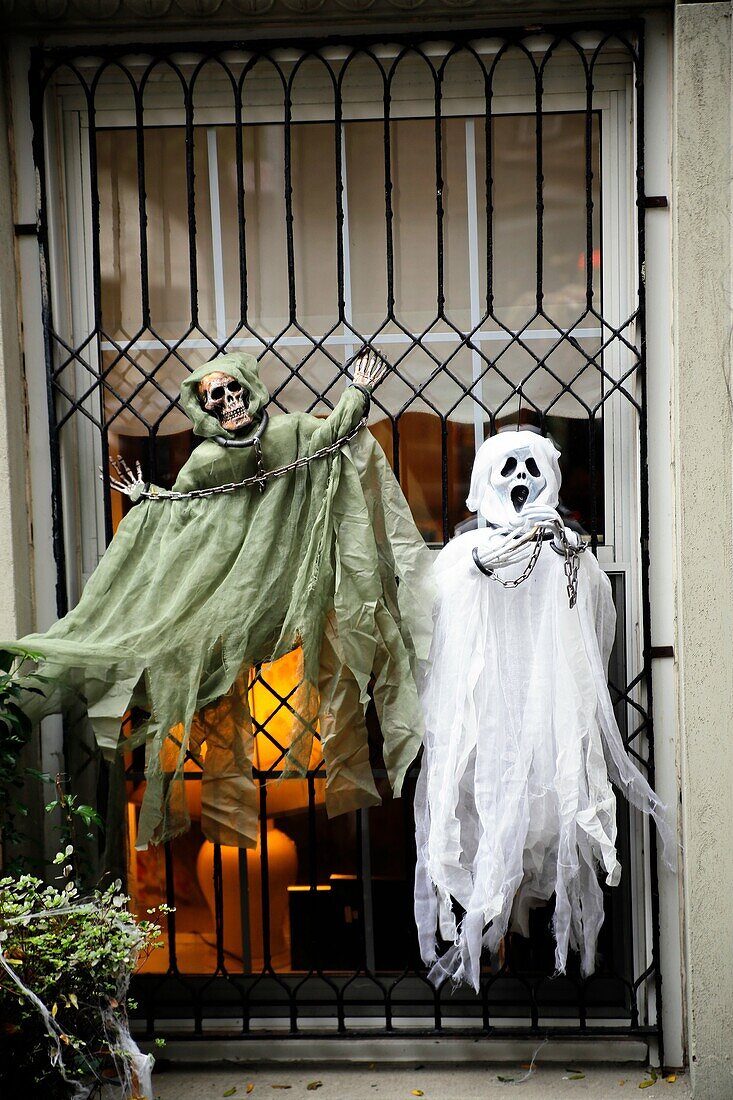 Halloween Ghost Dolls Decorating a Window of a New York City Town House