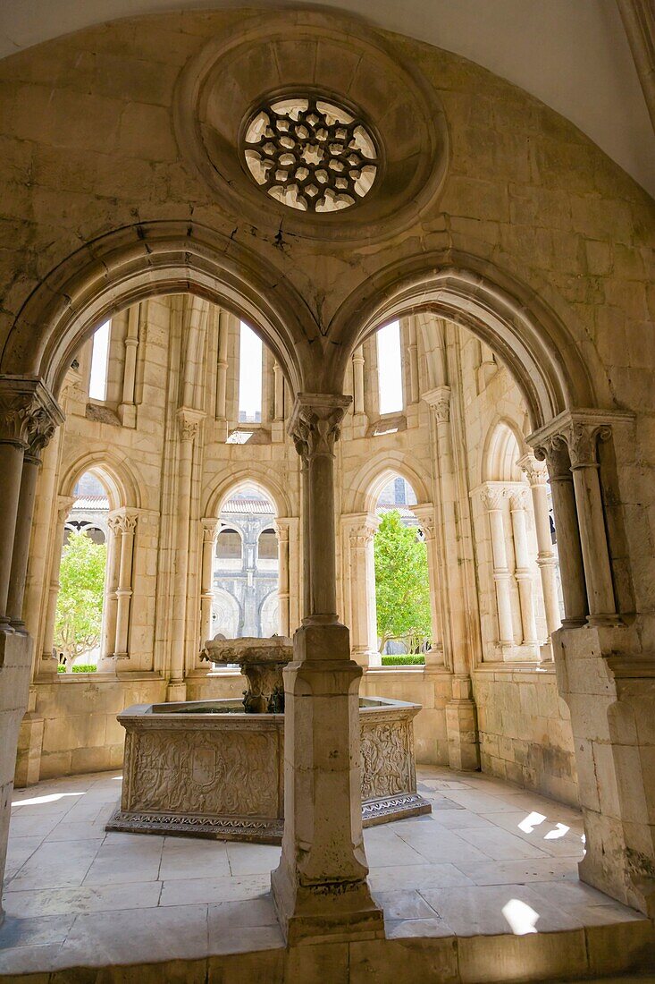 Renaissance water basin within the Gothic fountain house, Interior of Mosteiro de Santa Maria de Alcobaca, Alcobaca Monastery, Alcobaca, Oeste, Leiria District, Portugal