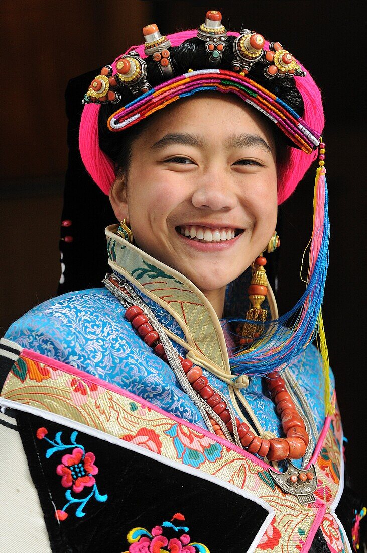 China, Sichuan, Kham, Danba, Young tibetan woman wearing the local traditional dress