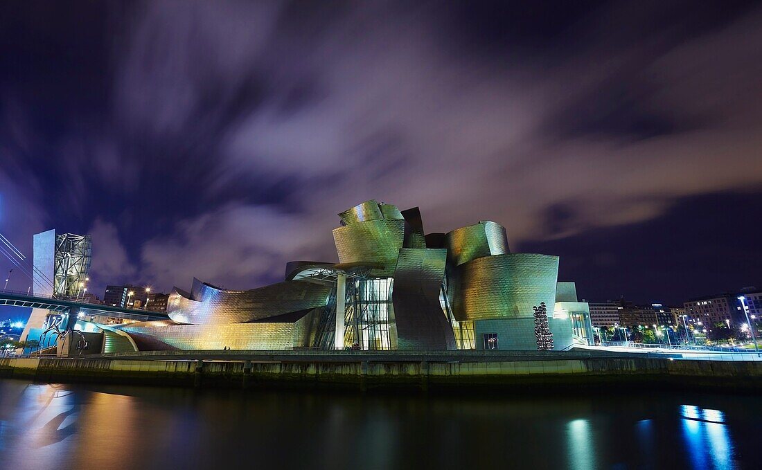 Panoramic night view of the Guggenheim museum and River Nervion, Bilbao, Biscay, Basque Country, Spain