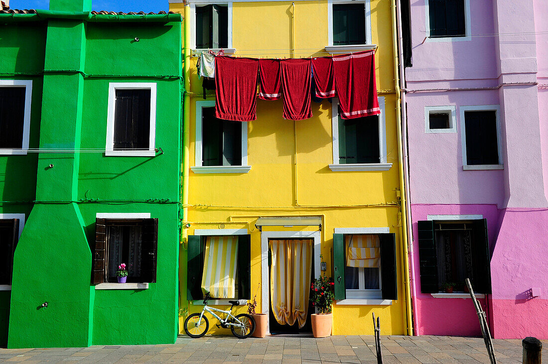 Colorful houses with hanging laundry in the island of Burano near Venice,Italy,Europe