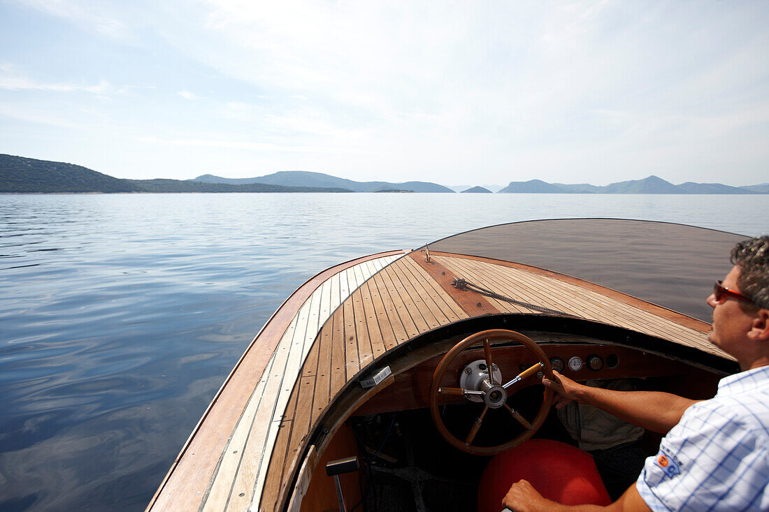 Motor boat on the Adriatic Sea near Sipanska Luka, Sipan island, Elaphiti Islands, northwest of Dubrovnik, Croatia