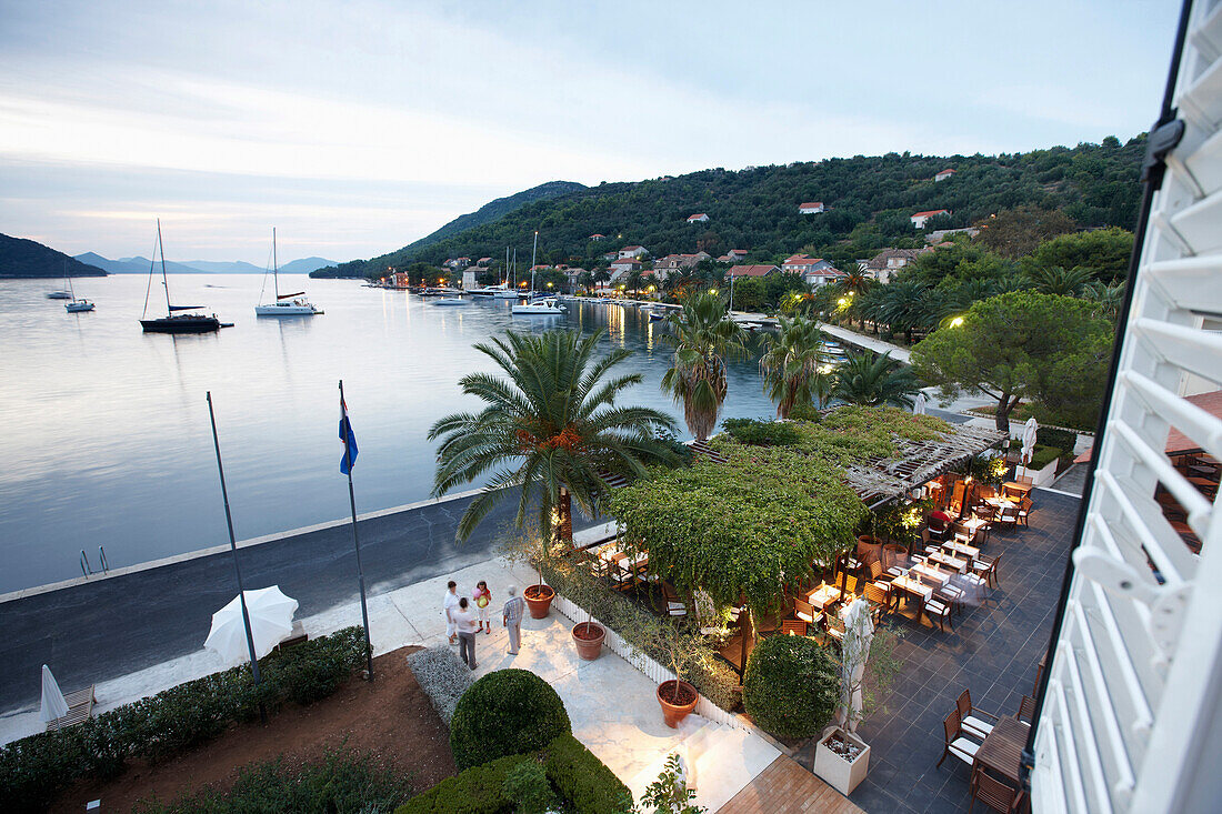 Terrace of the hotel restaurant along the natural harbour, Sipanska Luka, Sipan island, Elaphiti Islands, northwest of Dubrovnik, Croatia